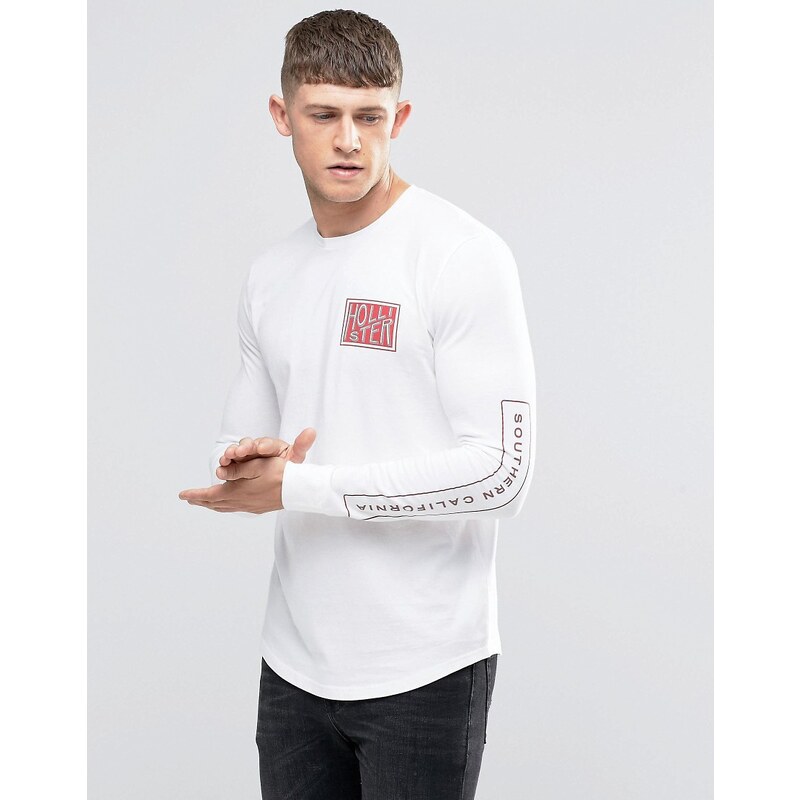 Hollister - T-shirt moulant ajusté à manches longues imprimées et motif sur le torse - Blanc
