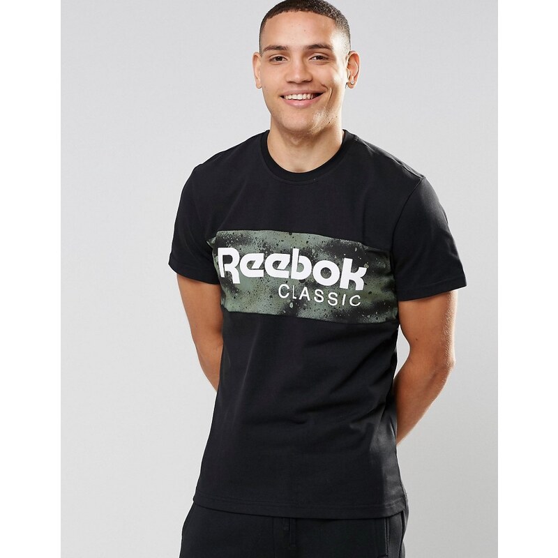 Reebok - AY1158 - T-shirt à imprimé camouflage effet pulvérisé - Noir - Noir