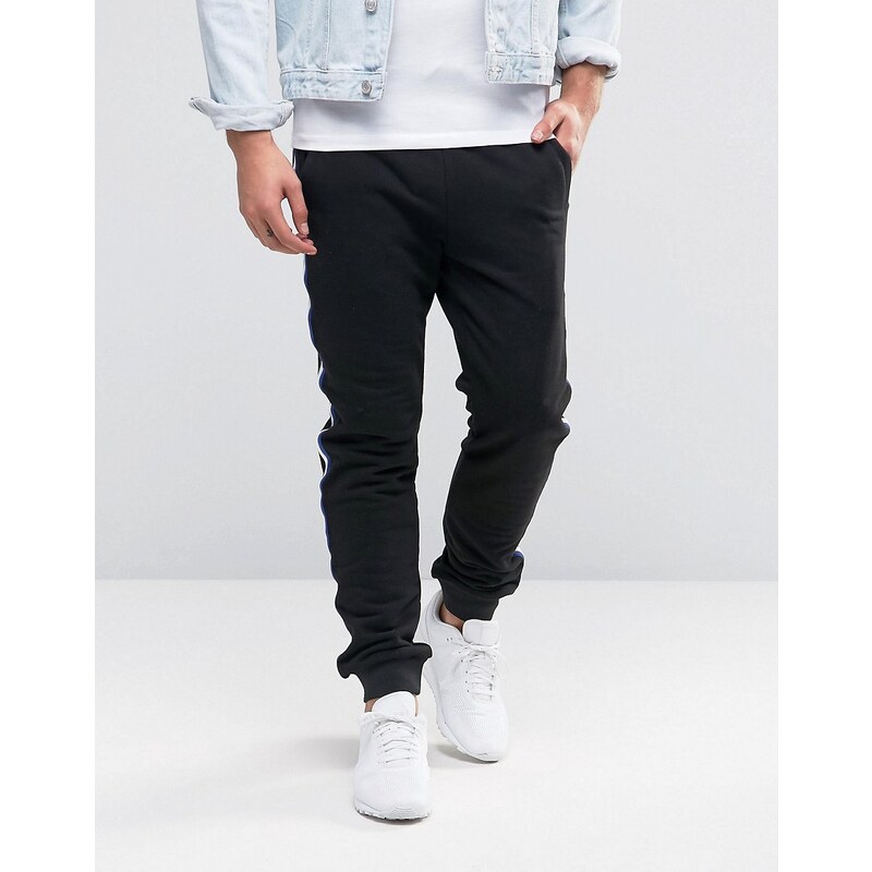 ASOS - Pantalon de jogging skinny avec bande de couleur tissée - Noir