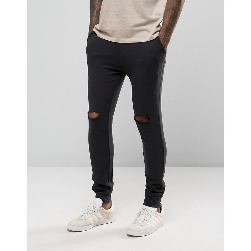 ASOS - Pantalon de jogging super skinny avec déchirures aux genoux - Noir délavé - Noir