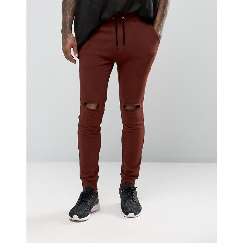 ASOS - Pantalon de jogging super skinny avec déchirures aux genoux - Rouge foncé - Rouge